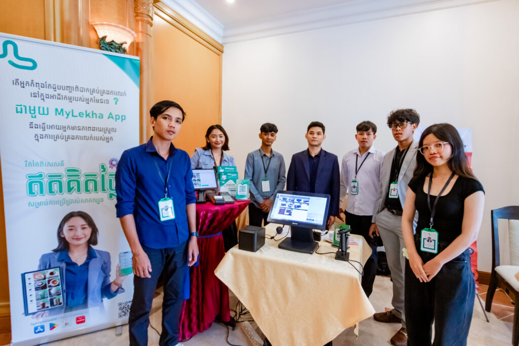 MyLekha team demonstrating POS for business management software at industry event